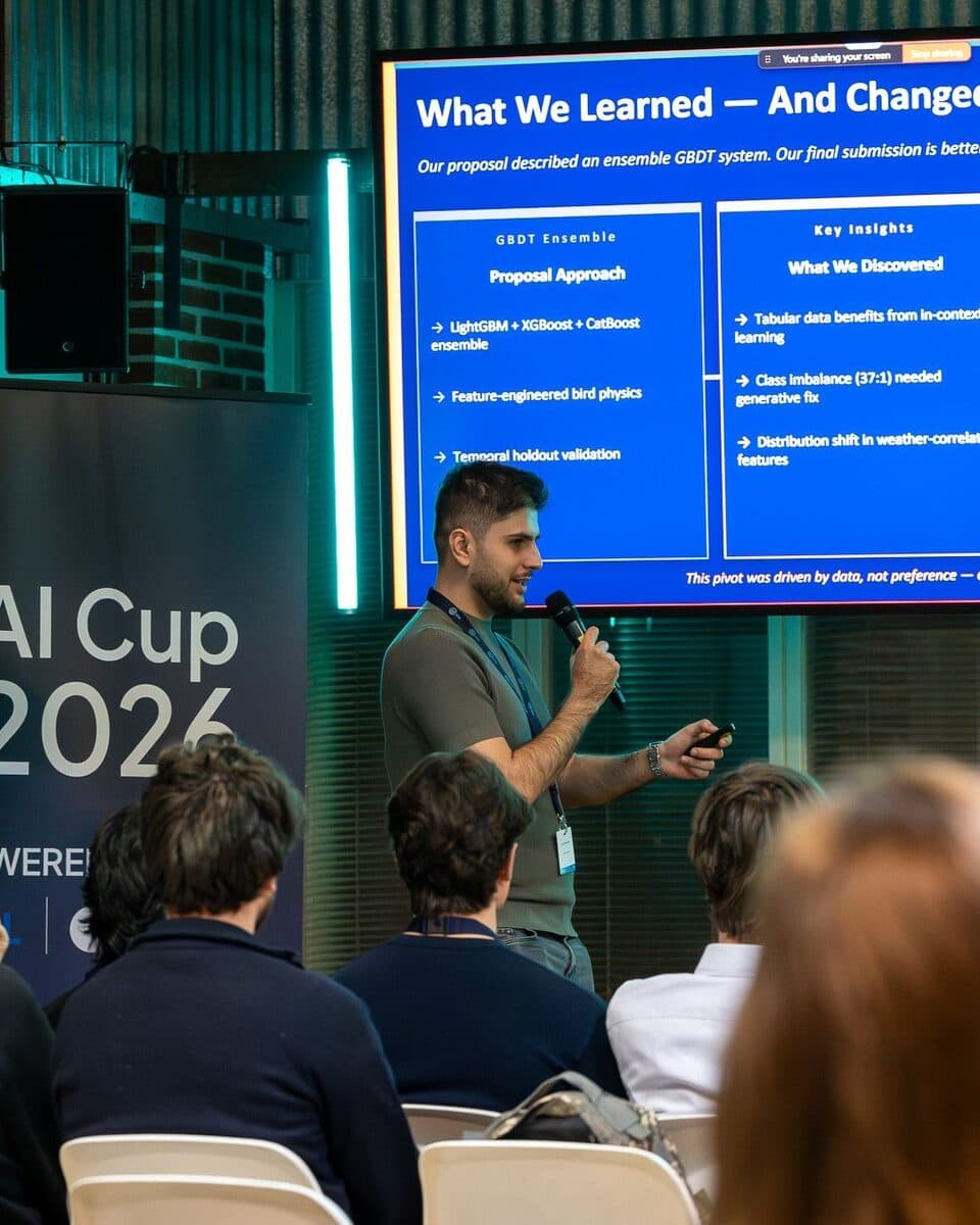 Sinan Çeviker presenting his team’s model at the AI Cup 2026